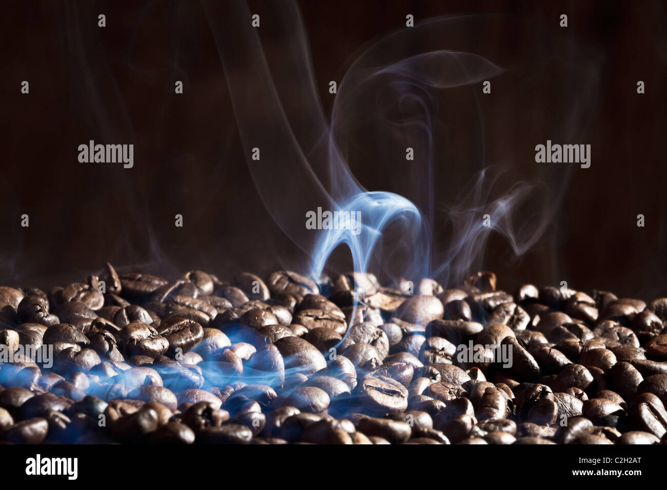 Fragrant roasted coffee beans on black background Stock Photo - Alamy