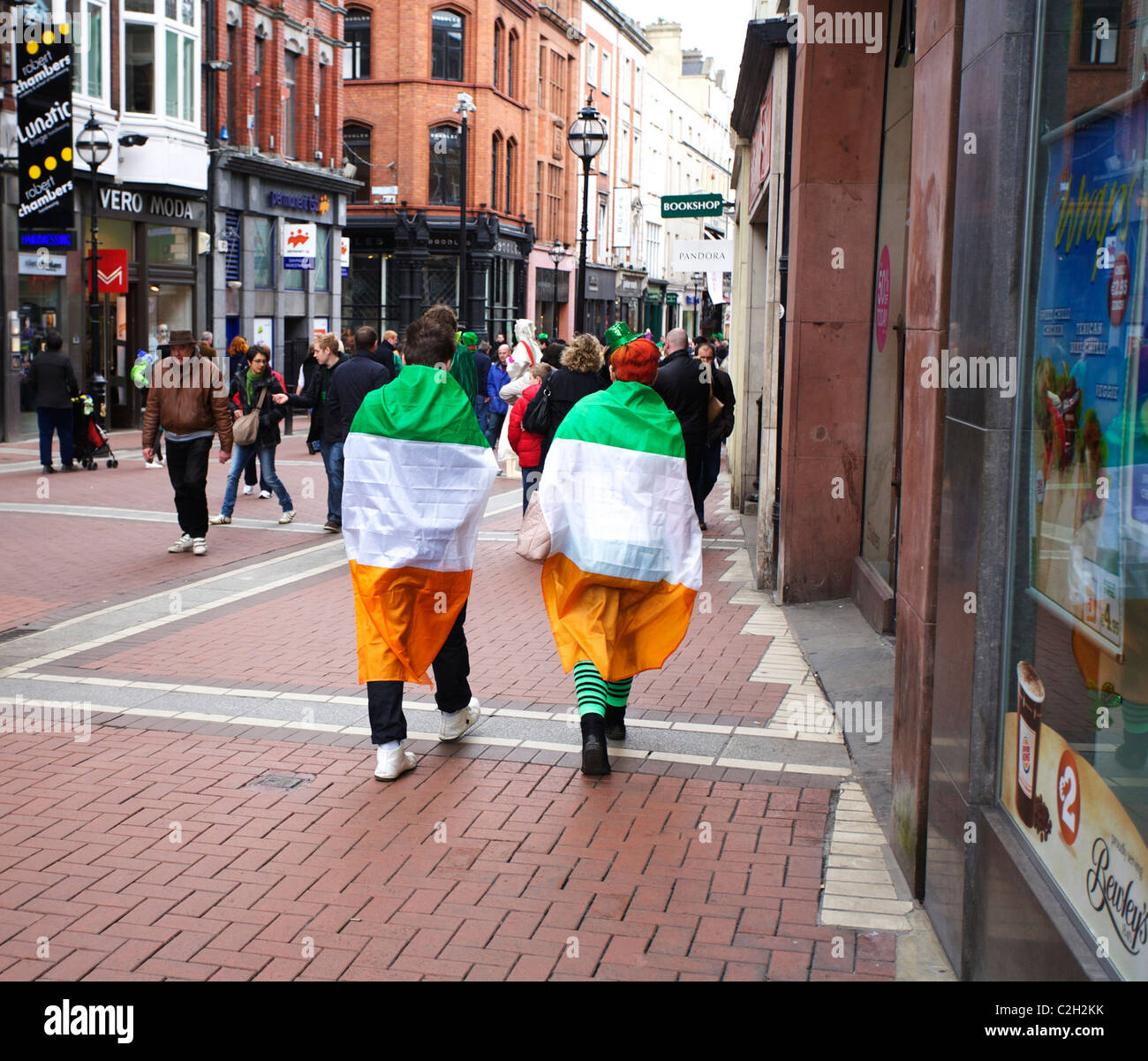 Visitors to the St Patricks Day parade and festival in Dublin, Ireland. Enjoying the 17th of March which is St Patricks Day celebrated every year Stock Photo