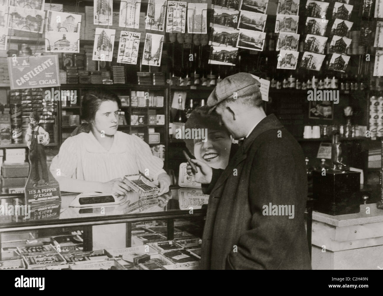 14 years old sells cigars in store of Mrs. Brisling in Boston. Stock Photo