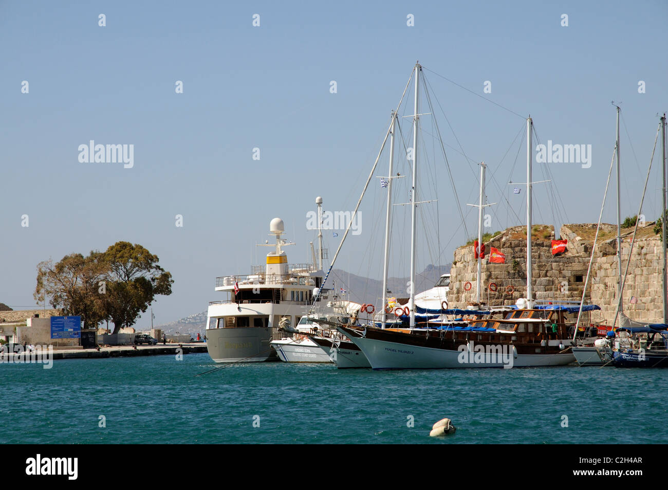 Visiting boats on Kos Town harbour on Kos Island Greece Stock Photo