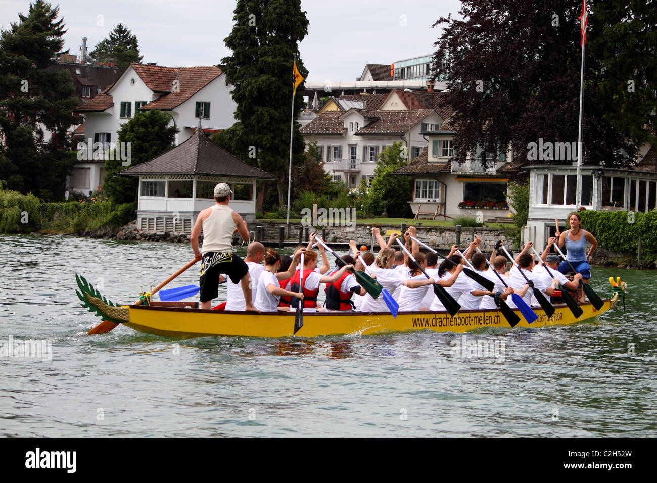 Athletes fought hard for victory and had fun at the dragen boat racing festival June 12, 2010 in Meilen, Switzerland. Stock Photo