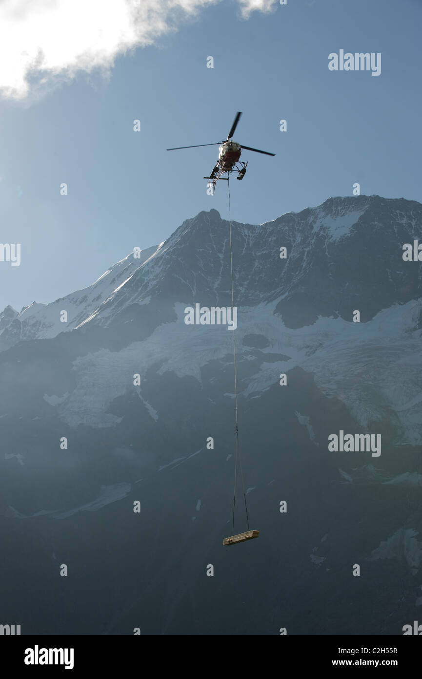 A transport helicopter in the Lauterbrunnen Valley, Switzerland Stock Photo