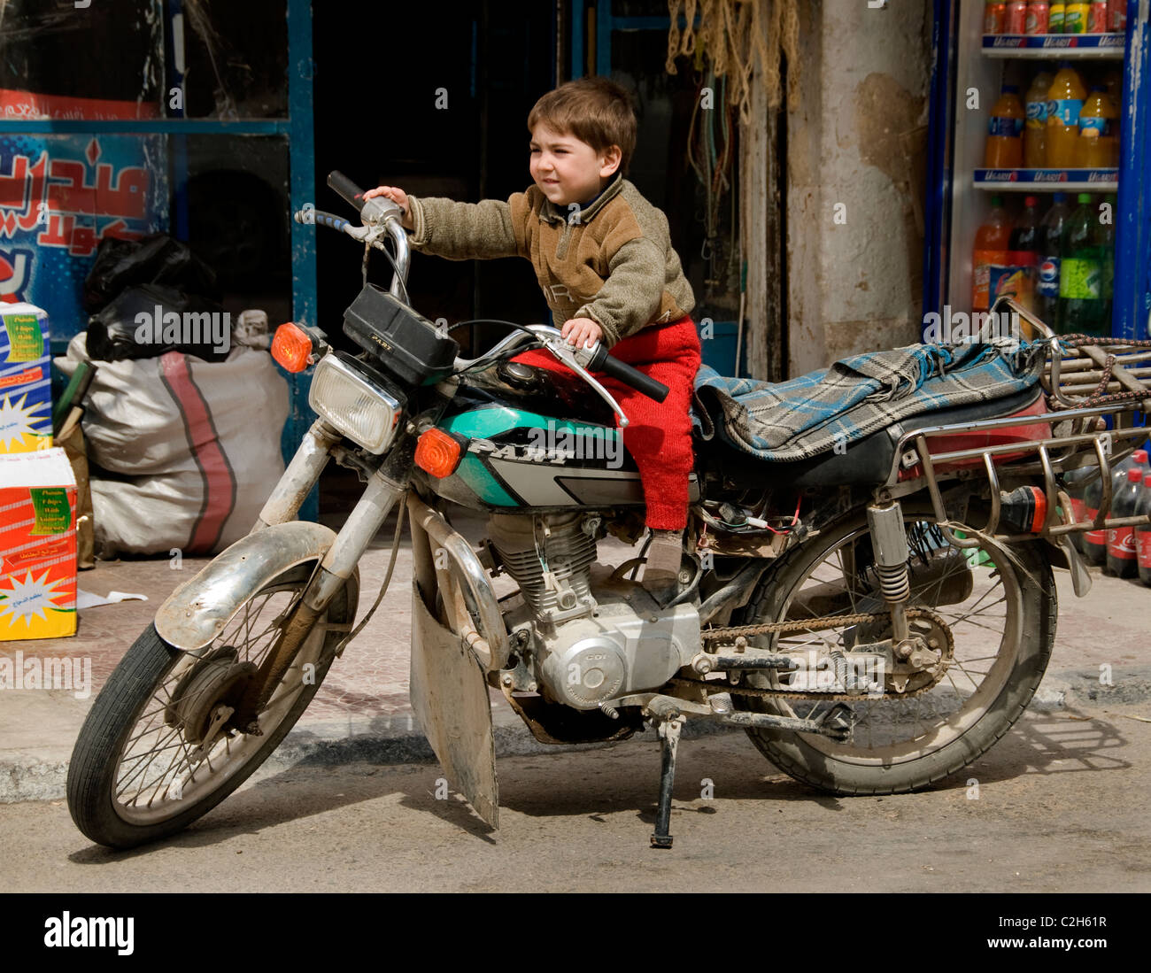 Palmyra new town city Syria Syrian motorcycle young boy motorbike Stock Photo