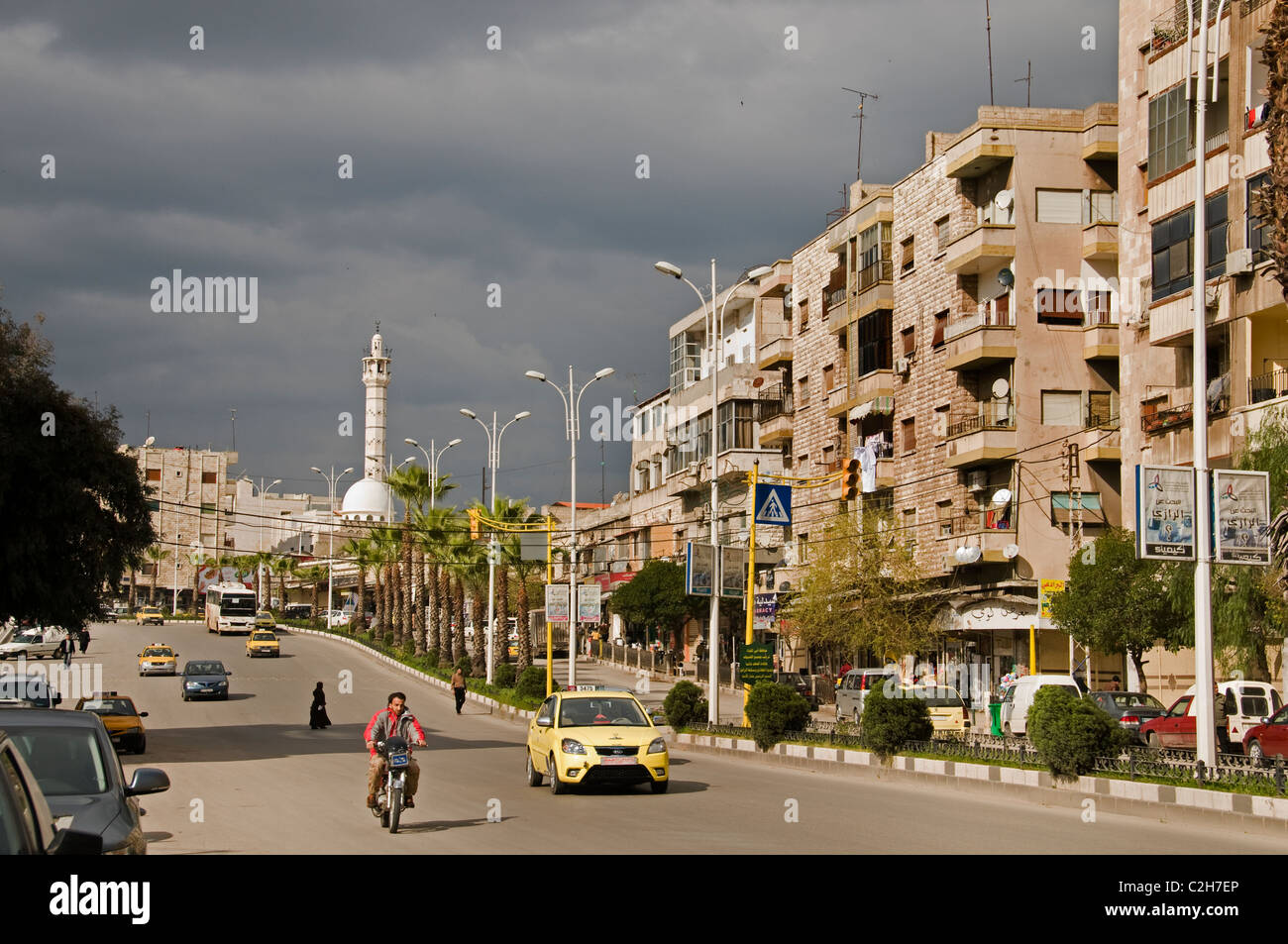 Hama Syria new traffic taxi road city modern town Stock Photo