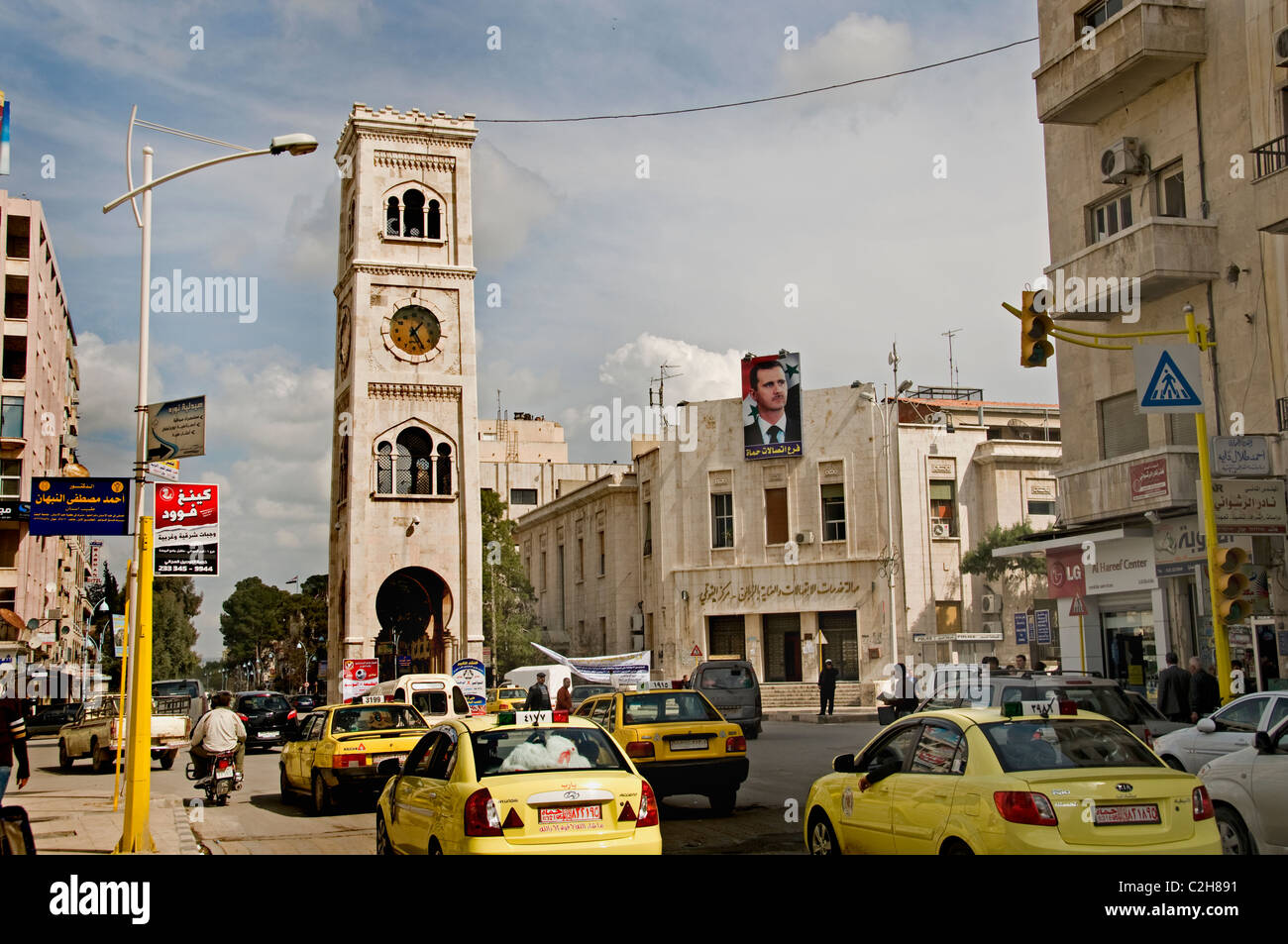 Hama Syria clock tower old city town center taxi Stock Photo