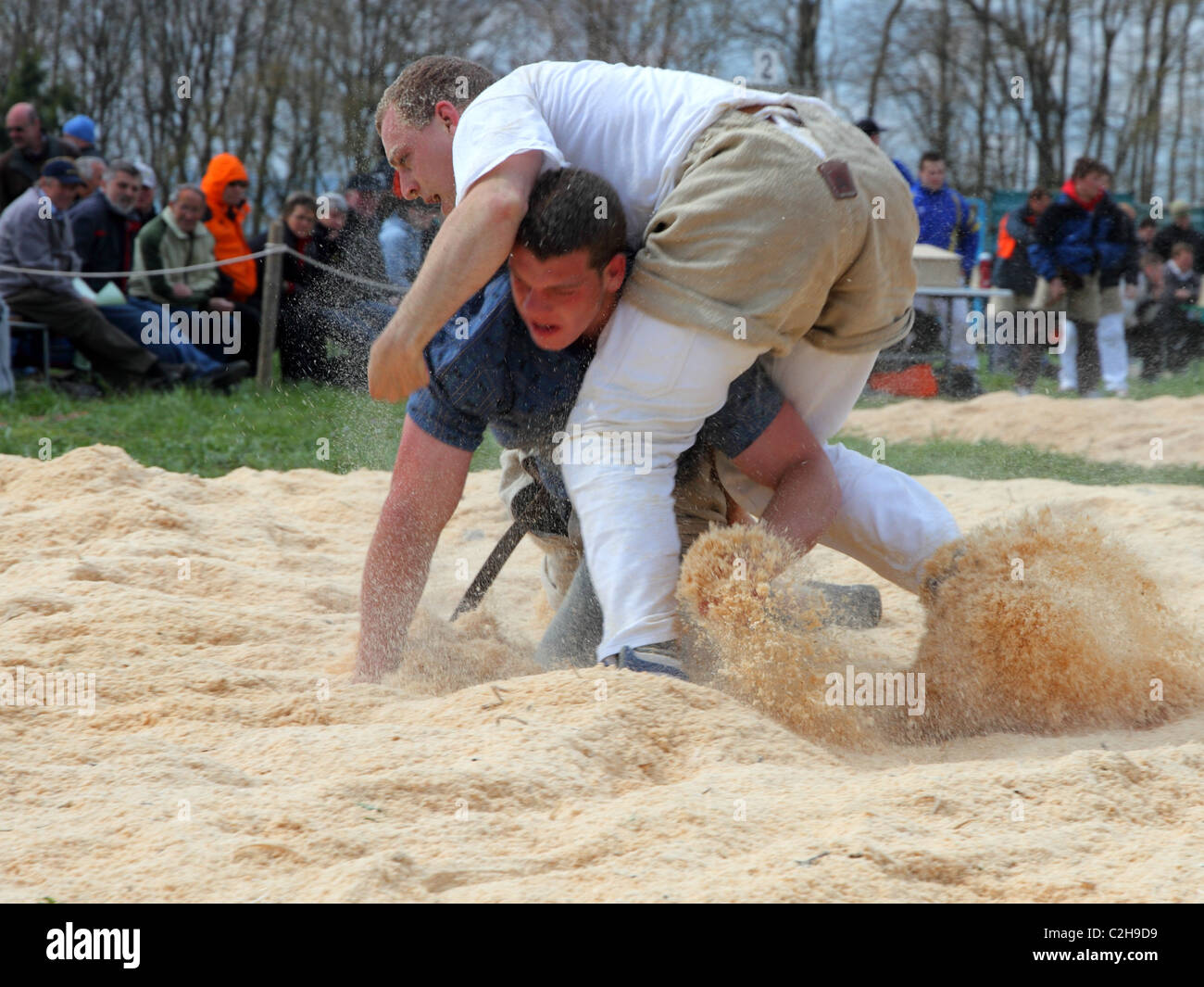 Swiss wrestling athletes fight for victory by throwing their opponent