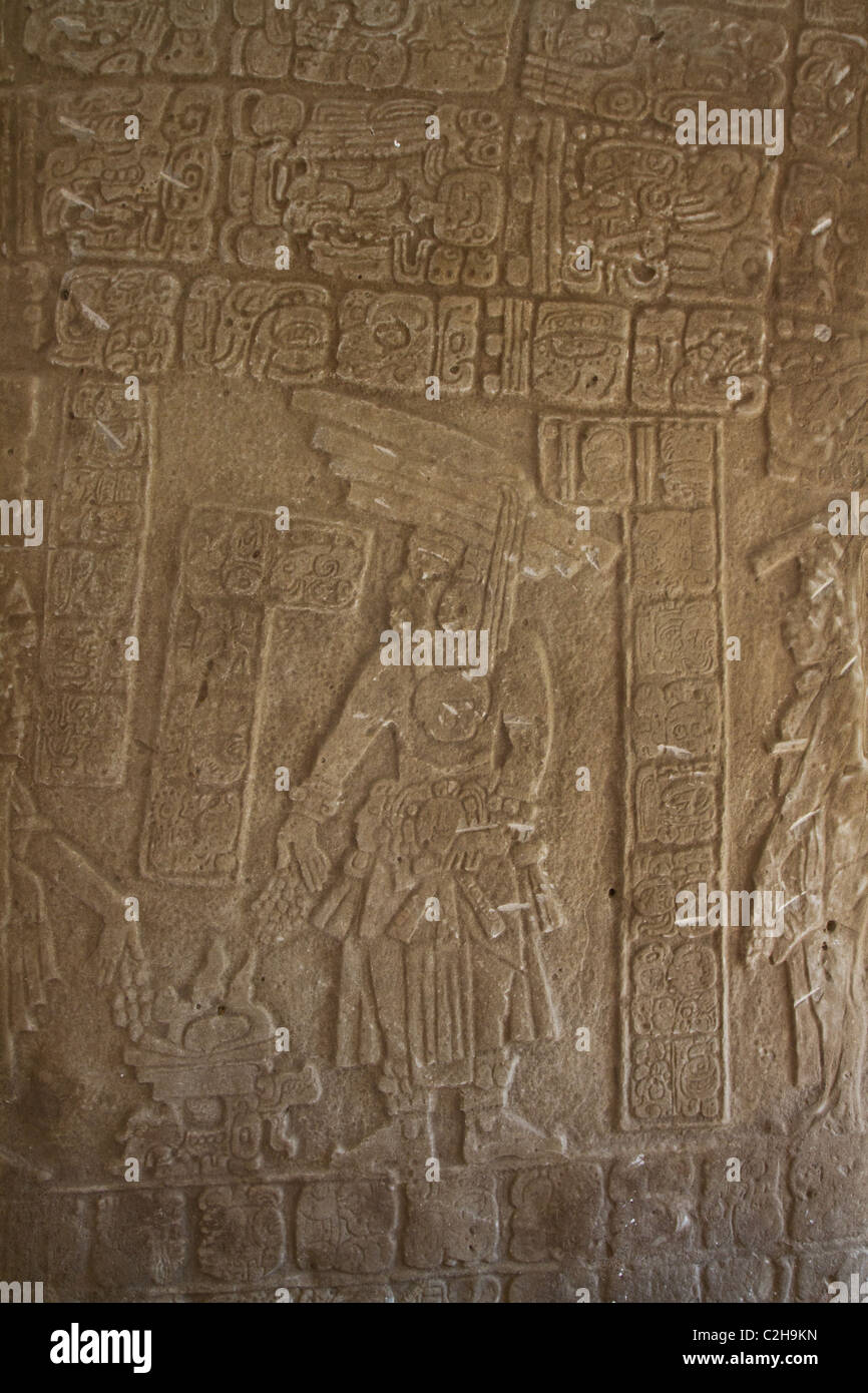 A Mayan carving in a stone tablet in Belize Stock Photo