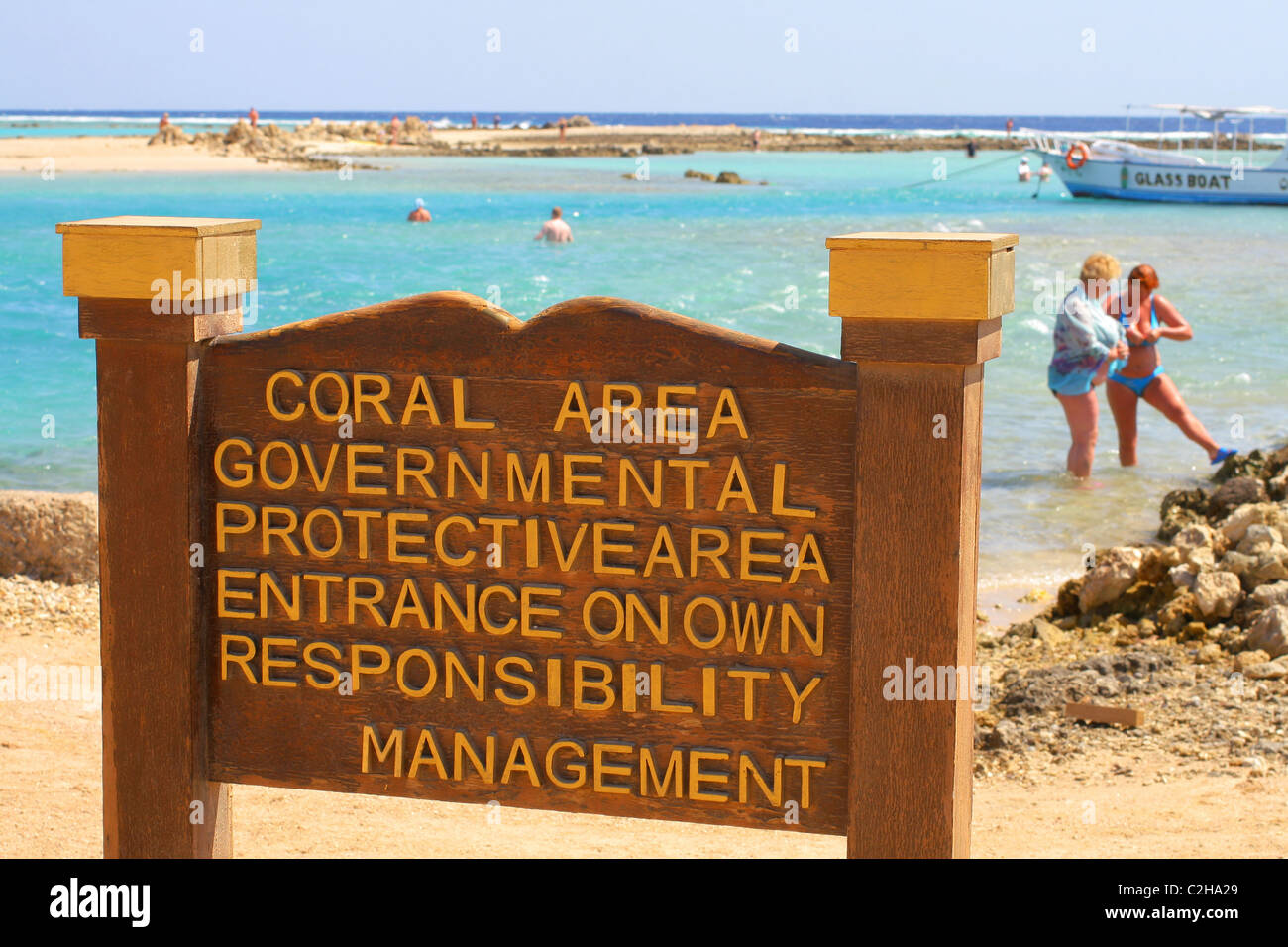 Sign 'Coral area governmental  protective area entrance on own responsibility'.Makadi Bay 30km south of Hurghada, Red Sea, Egypt Stock Photo