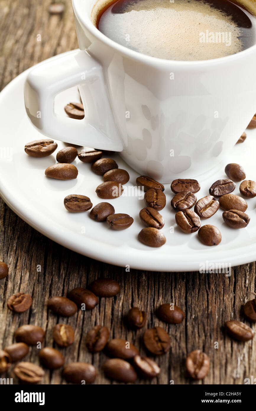 the-cup-of-espresso-with-coffee-beans-stock-photo-alamy