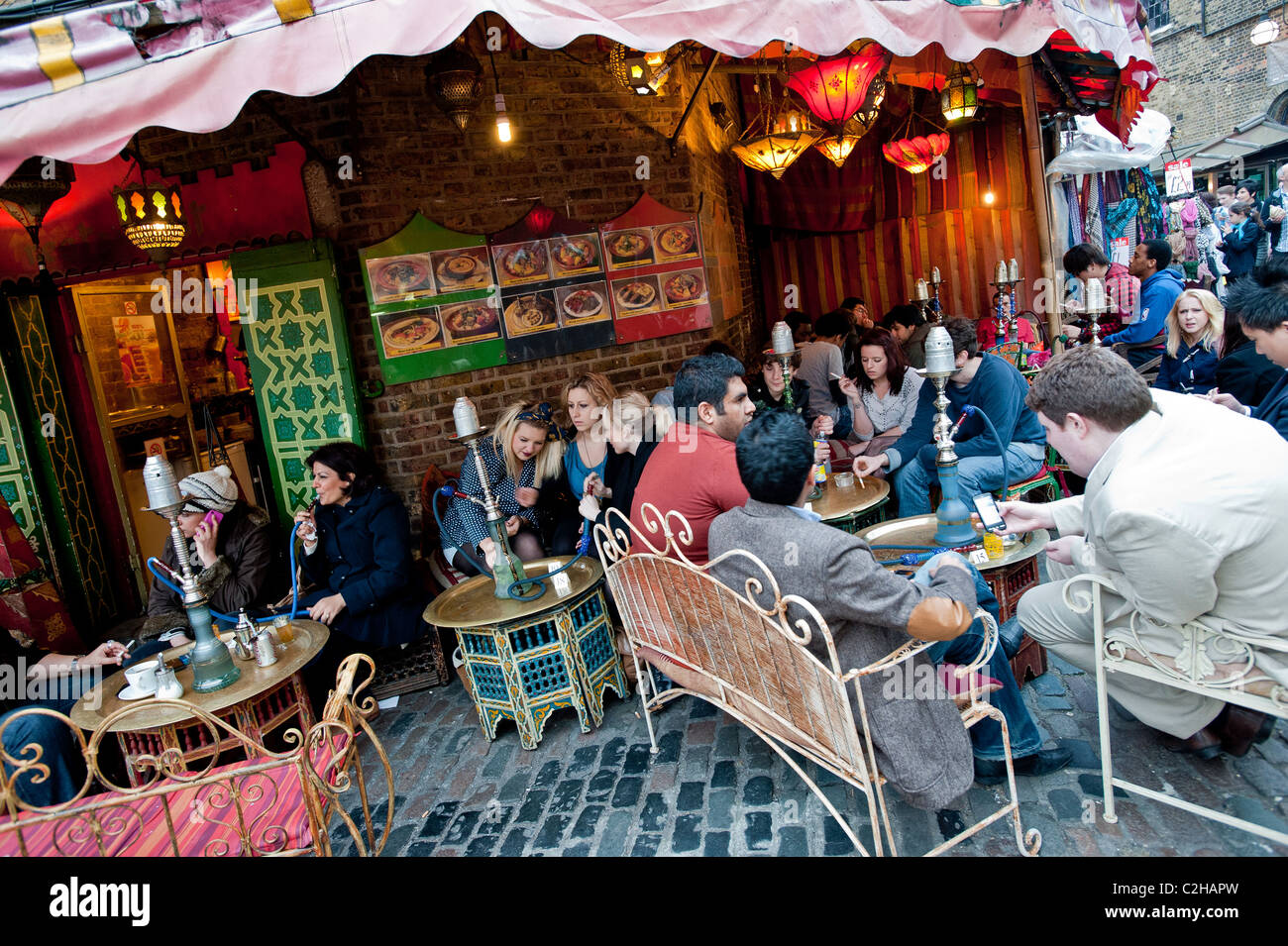 Shisha smokers in Moroccan cafe bar, The Stables Market, Camden, NW1, London, United Kingdom Stock Photo