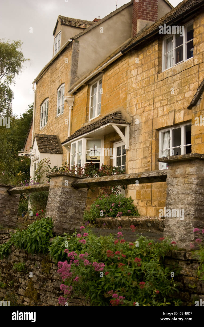 row terrace house stone cotswold structure building flat mortar blocks carved masonry hand crafted wall interlock home quaint Stock Photo