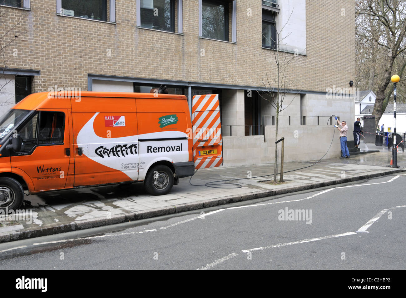 Removing graffiti, London, UK. Stock Photo
