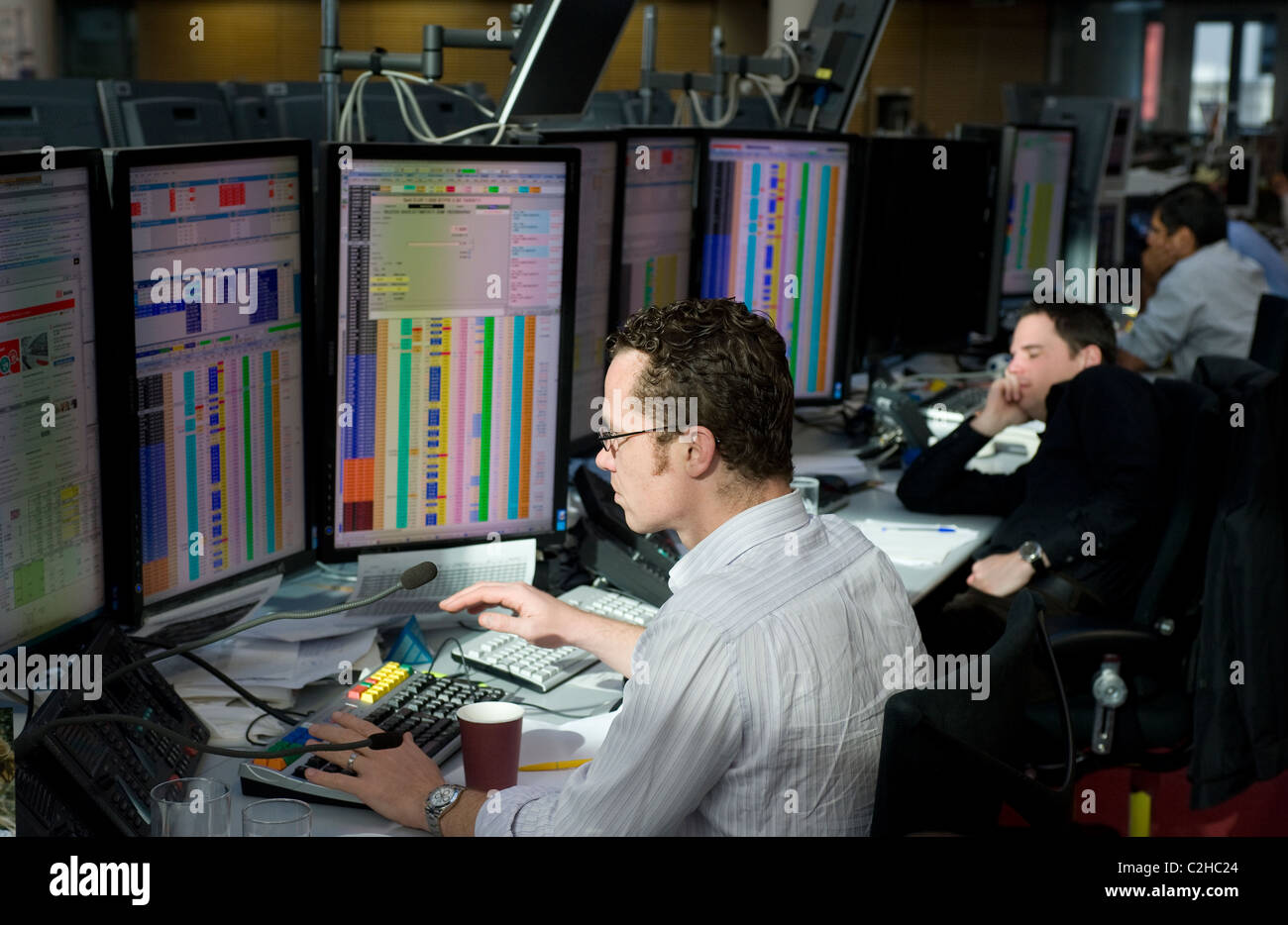Dealers in securities at the screens of their computers, Frankfurt am Main, Germany Stock Photo