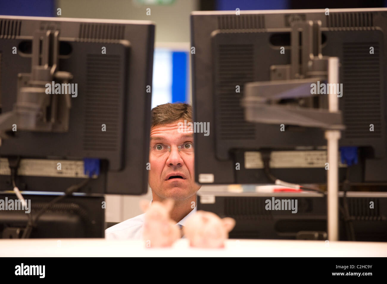 An equity trader at the screen of his computer, Frankfurt am Main, Germany Stock Photo