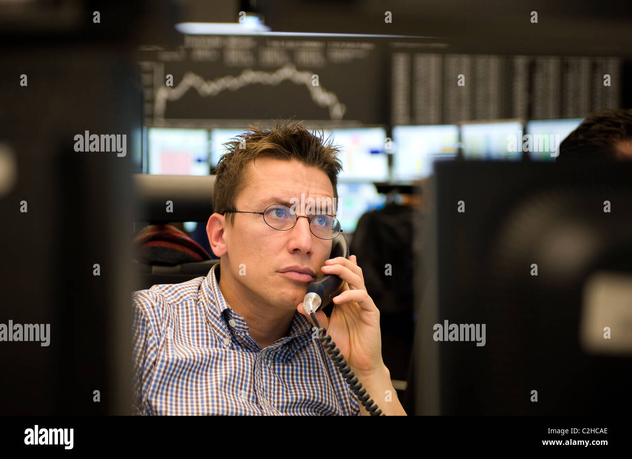 An equity trader at the screen of his computer, Frankfurt am Main, Germany Stock Photo