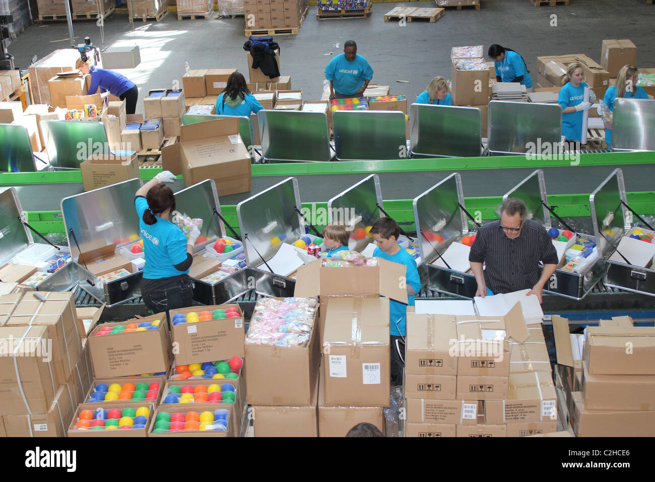 Volunteers packing aid kits in Unicef Supply Division in Copenhagen Stock Photo Alamy