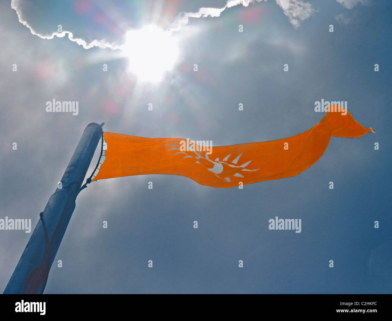 saffron color flag against the background of the Sky, India Stock Photo -  Alamy