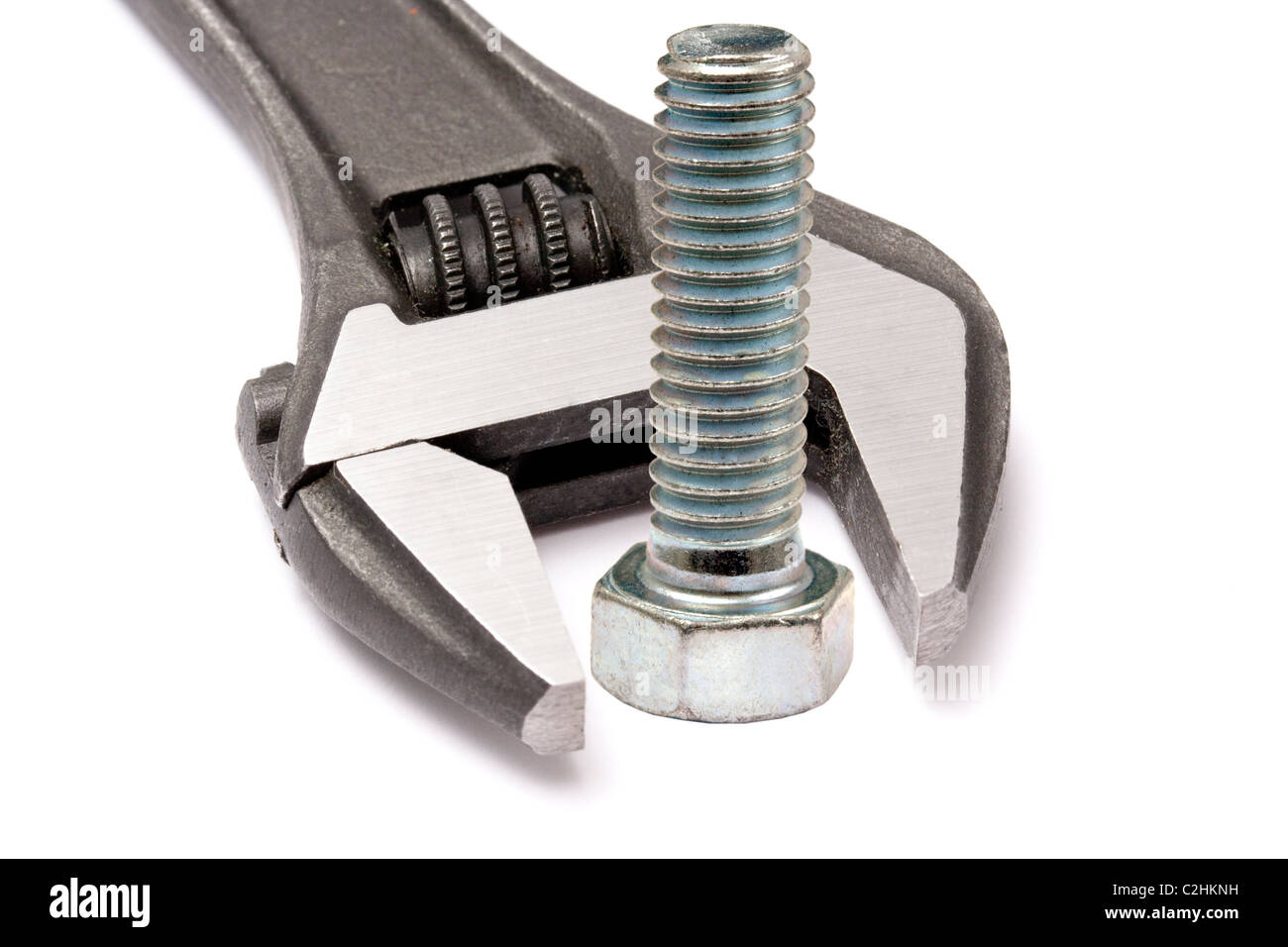Adjustable wrench and bolt isolated on white background Stock Photo - Alamy
