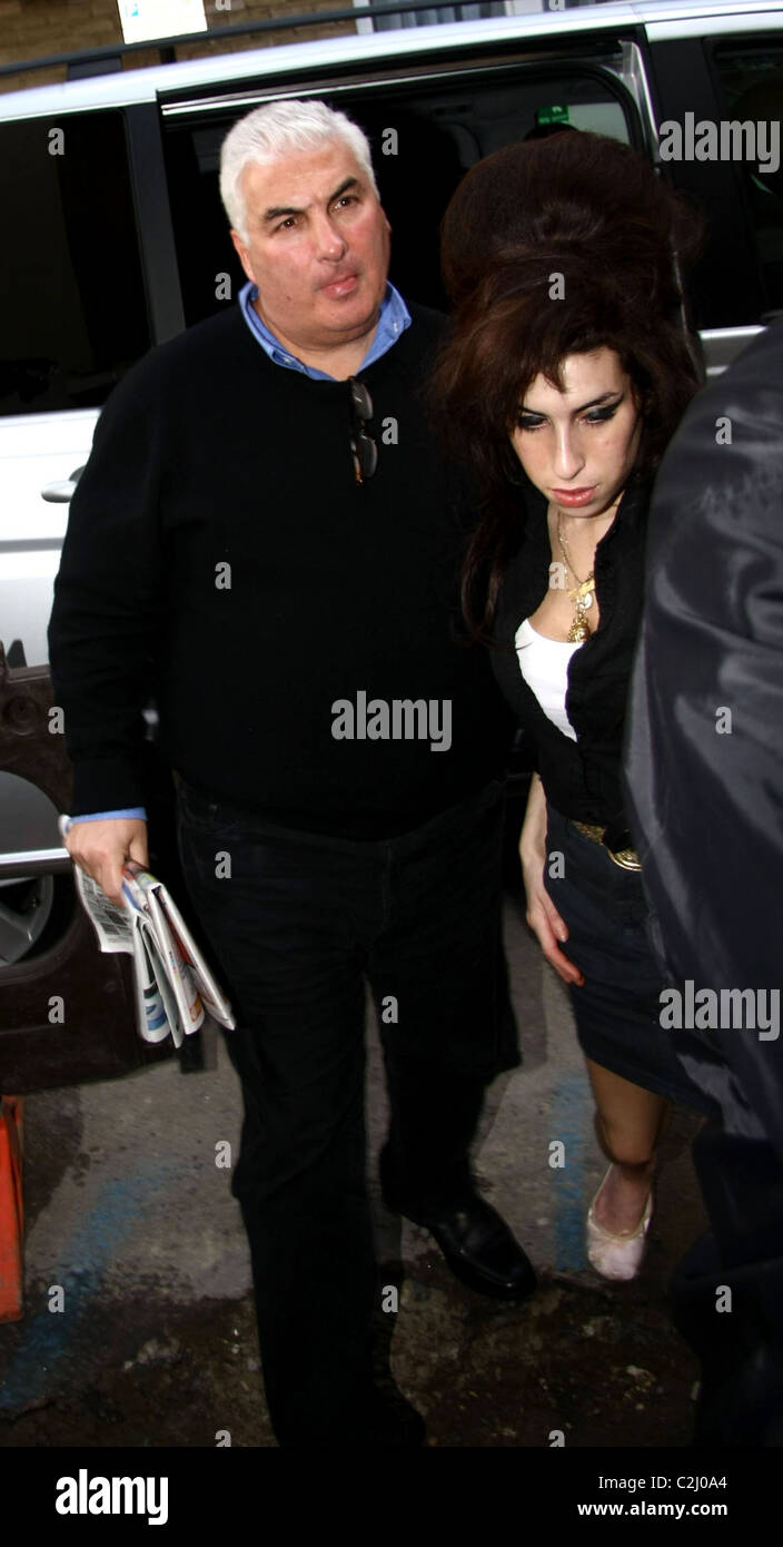 Amy Winehouse and father Mitch Winehouse Amy Winehouse leaves the the(00)