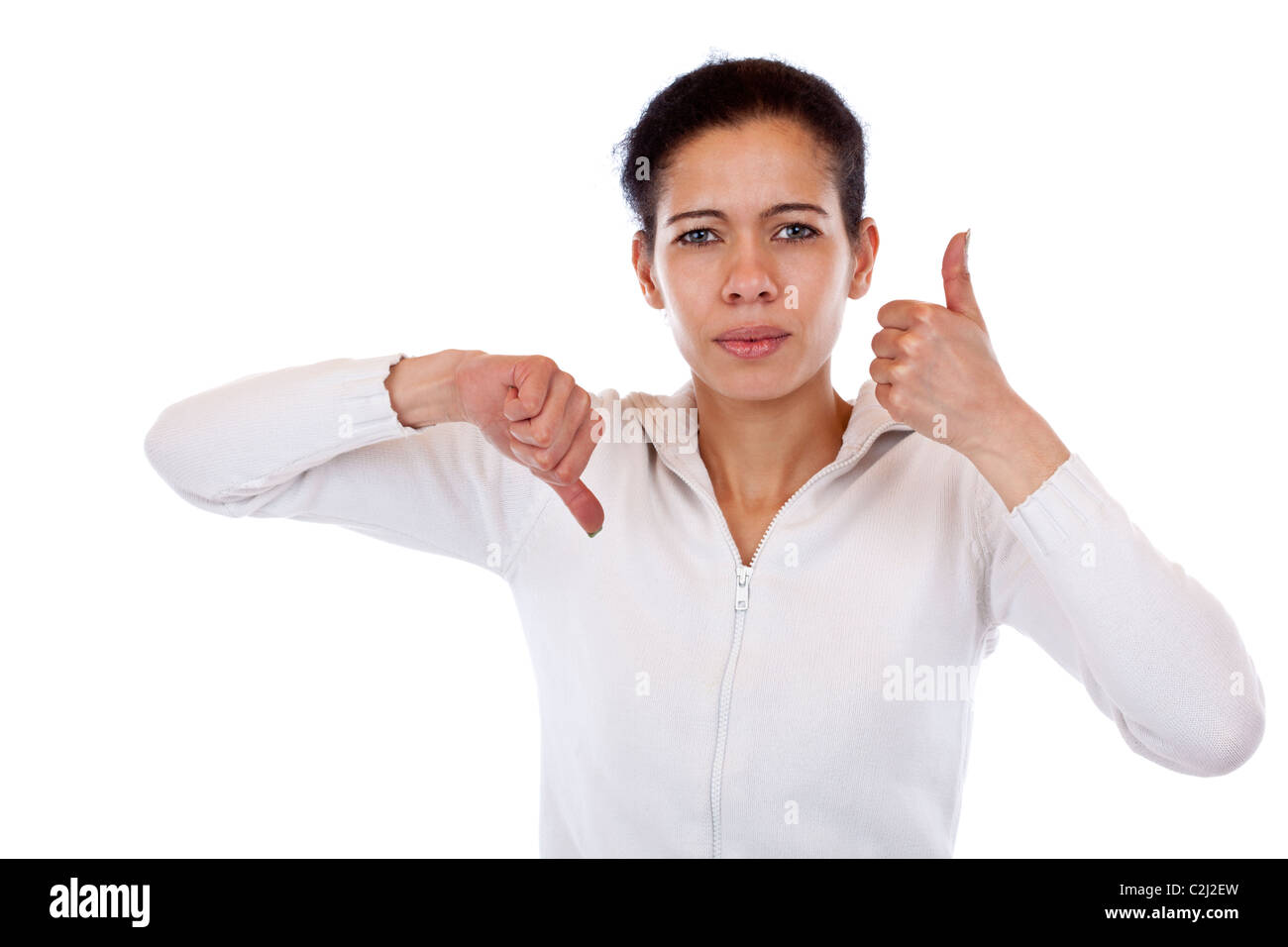 Woman is undecided and shows thumb up and down. Isolated on white ...