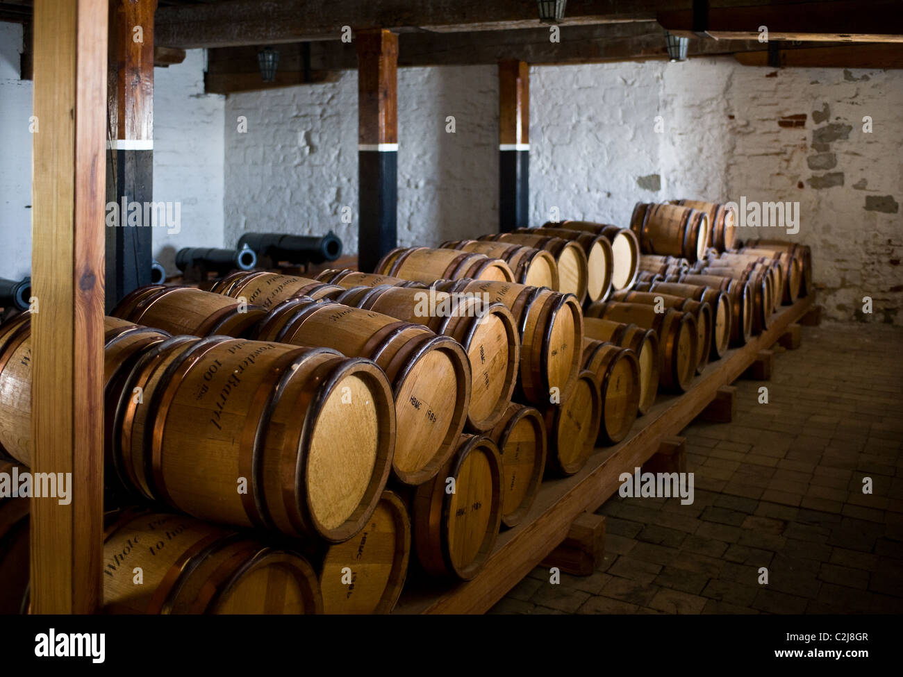 Barrels of gunpowder stacked in the magazine room at Upnor Castle in Kent Stock Photo
