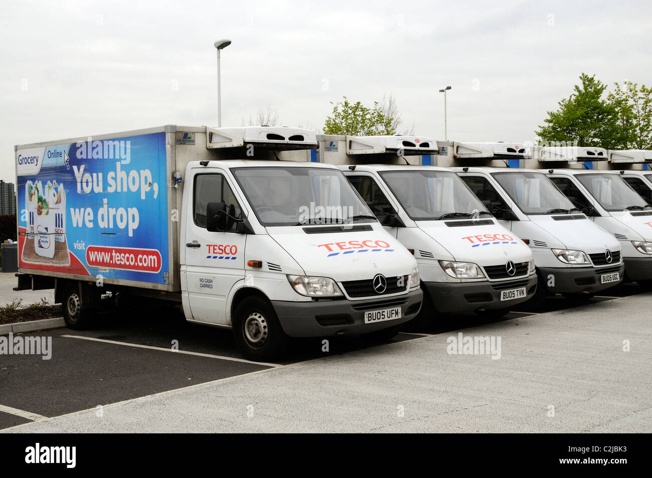 Row of Tesco store delivery trucks Stock Photo