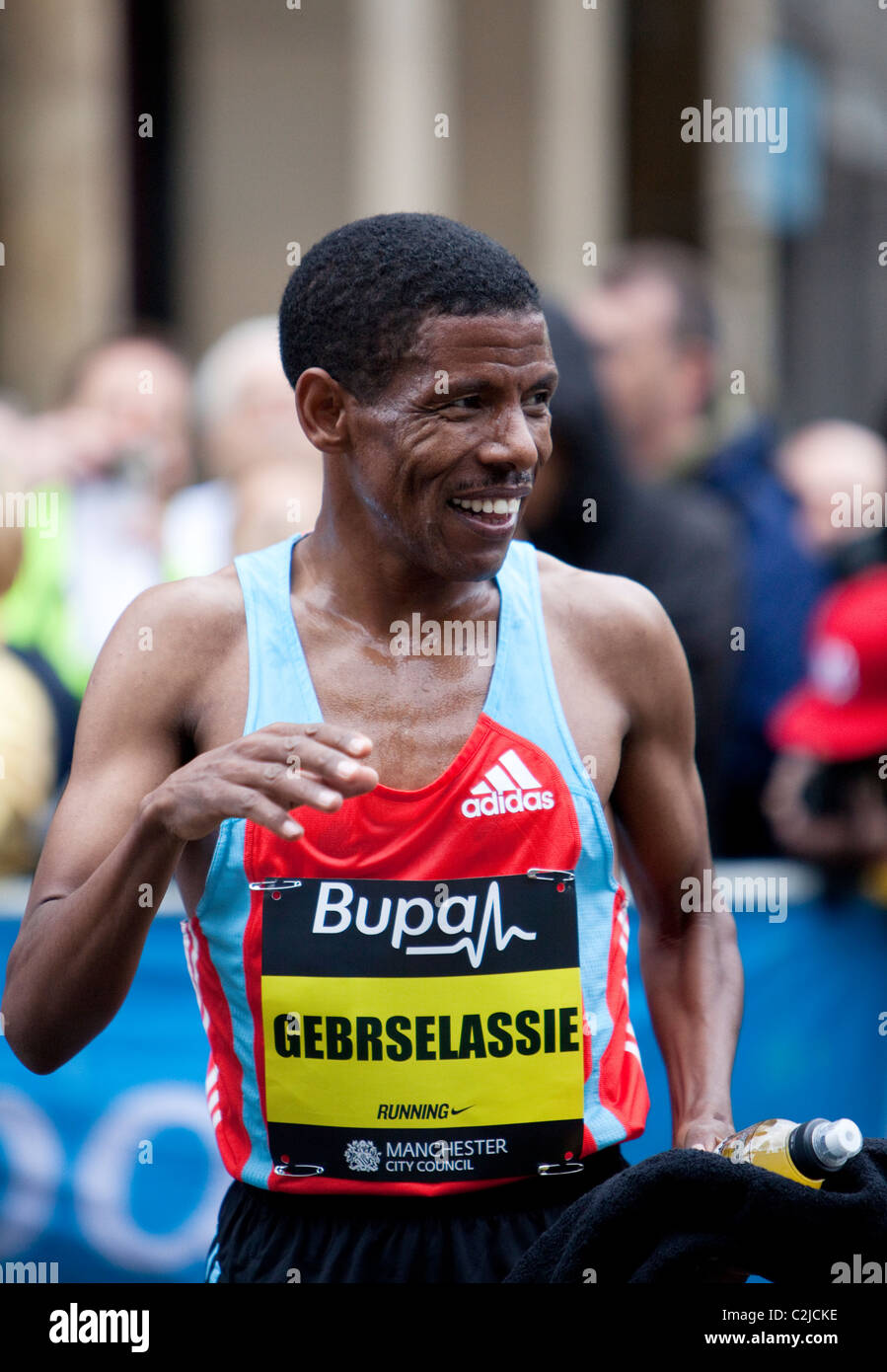 Haile Gebrselassie celebrates after winning the Manchester 10k run in 2010 Stock Photo