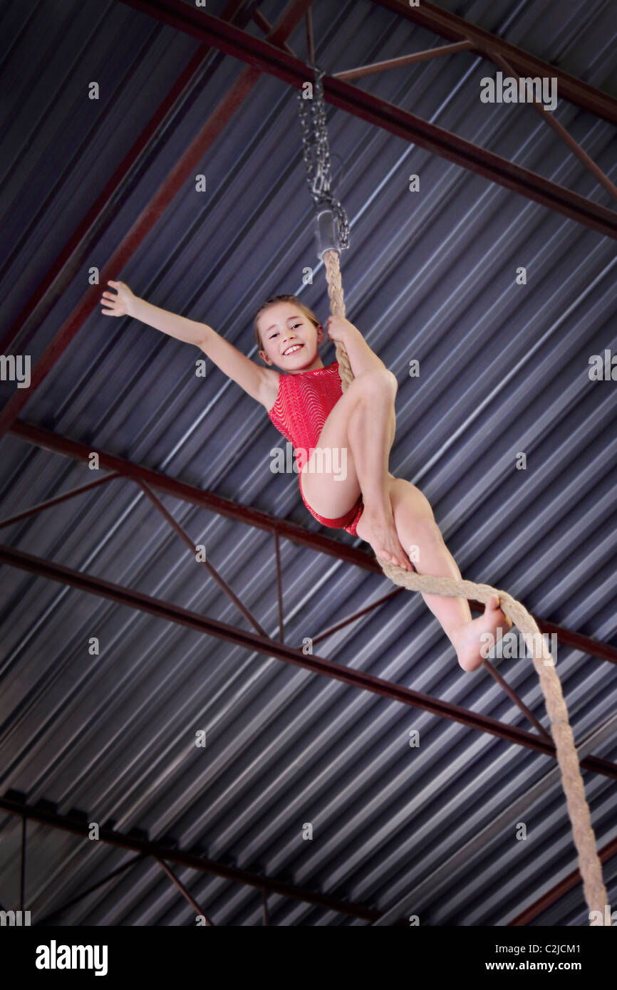 Child Climbing A Rope In Gymnastics Stock Photo - Alamy