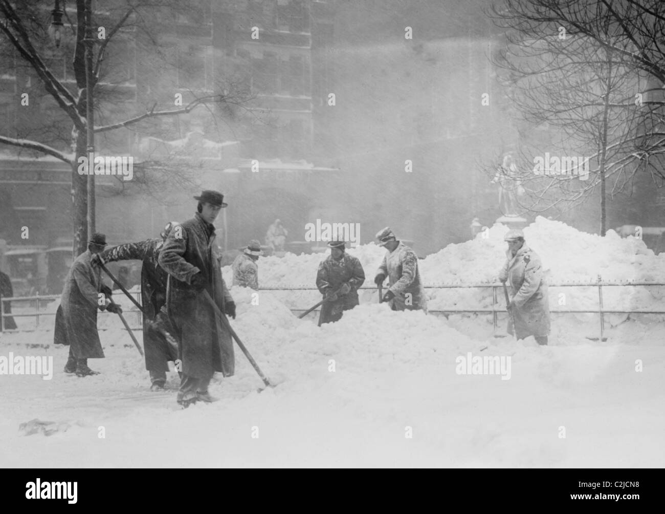 Artillery Men in Training Load Big Gun with Massive Shell Stock Photo