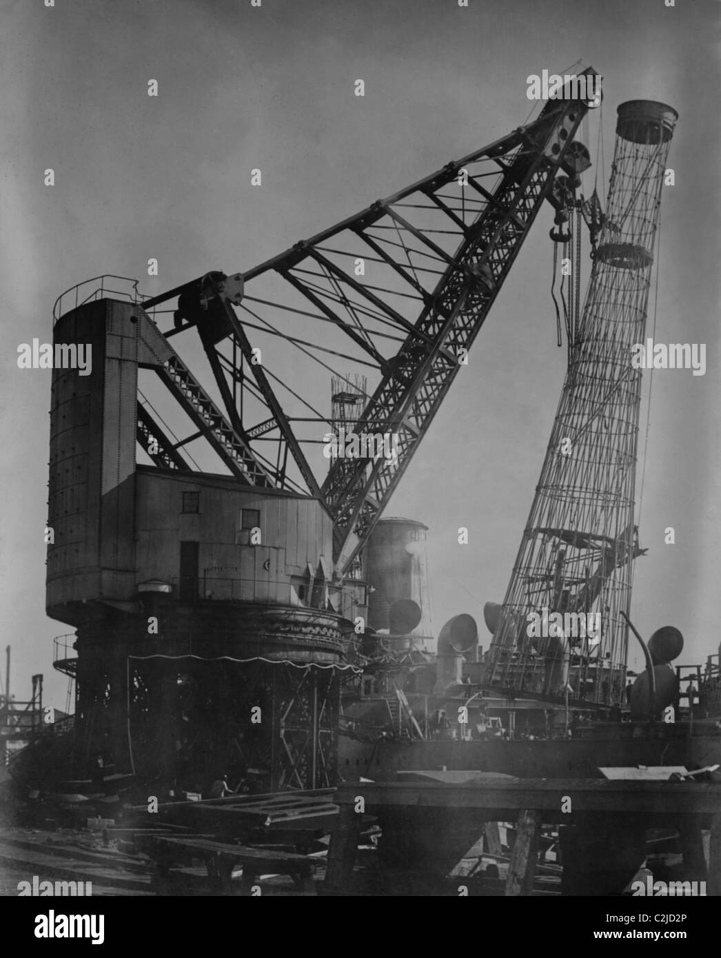 Giant Crane Lift Battleship Tower at Newport News Shipbuilding Stock