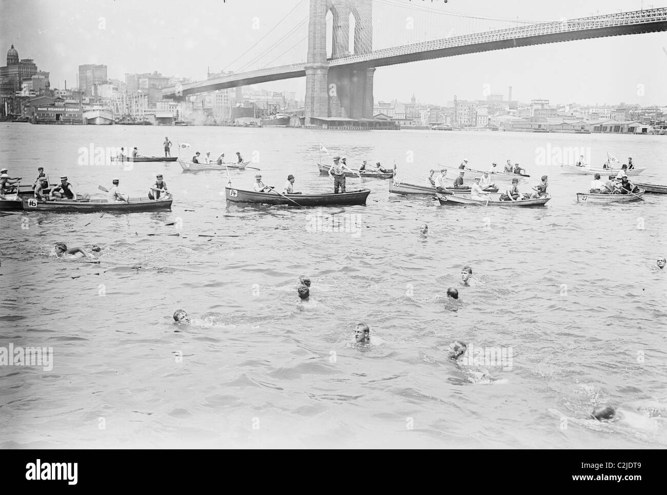 Swimmers Race to Coney Island just past the Brooklyn Bridge Stock Photo
