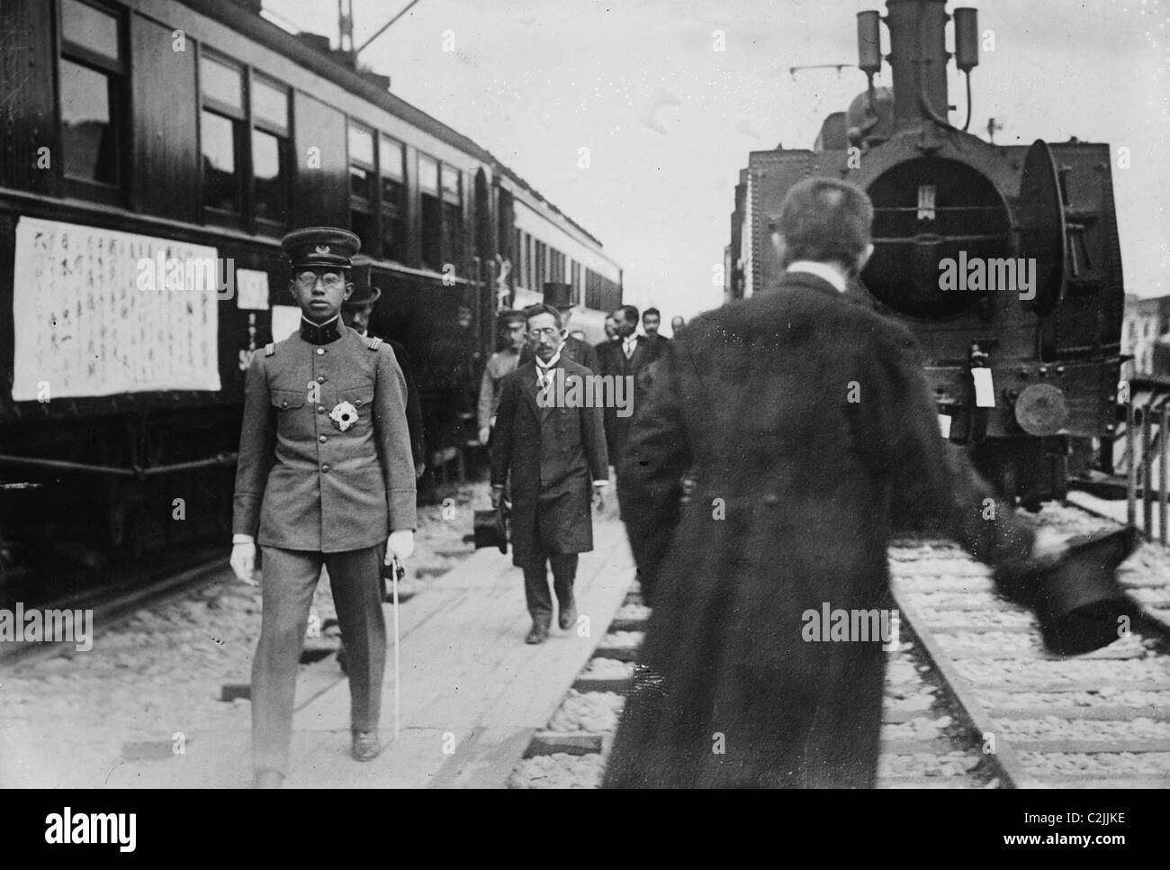 Crown Prince, in uniform walks beside a train at station Stock Photo