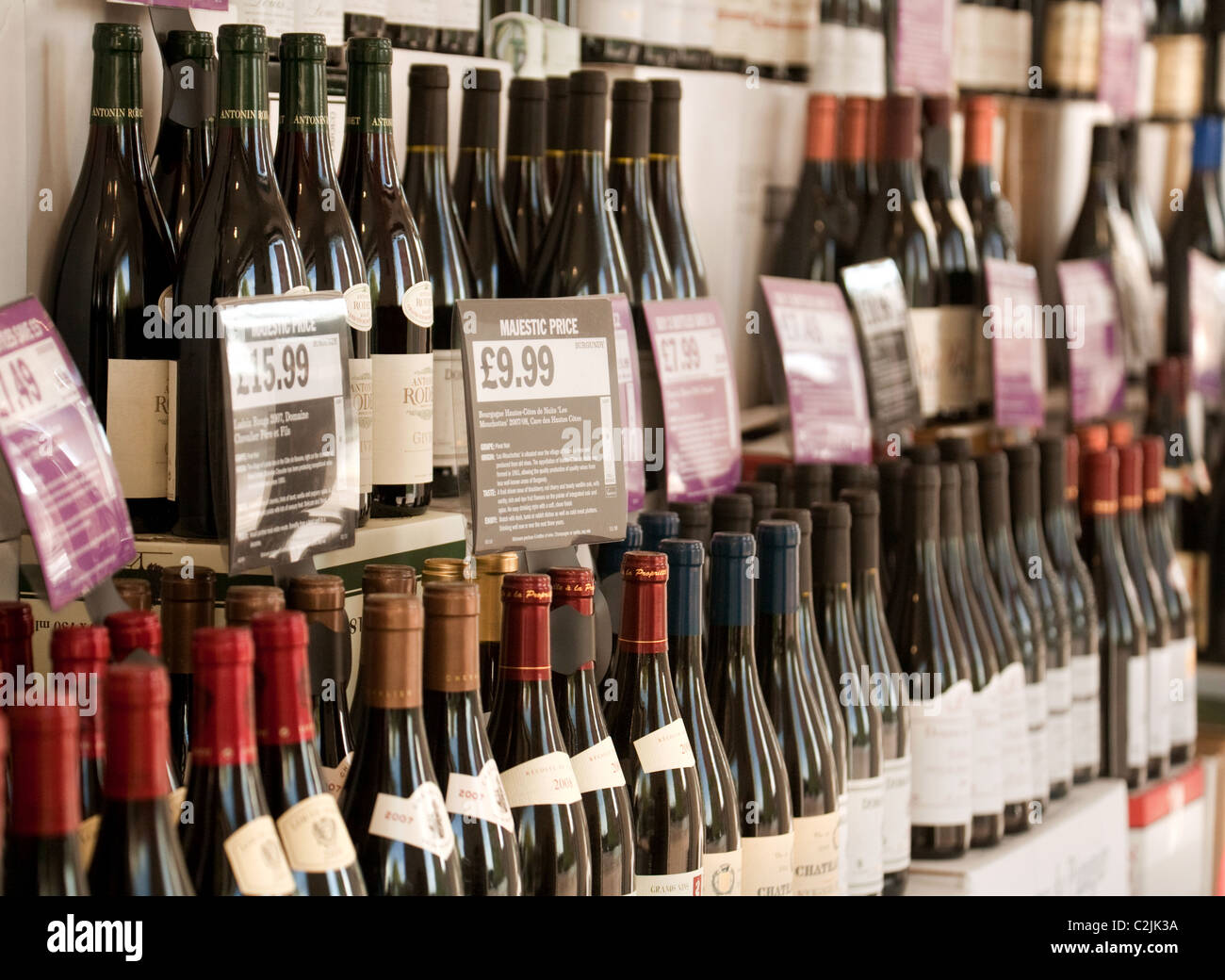 Bottles of red wine for sale in a Majestic wine store, Newmarket Suffolk UK Stock Photo