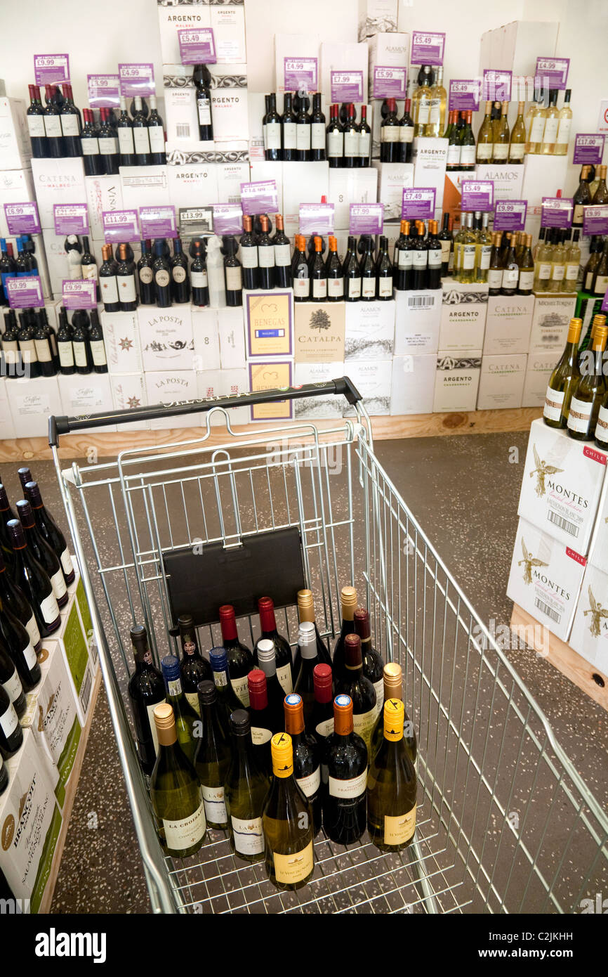 Shopping trolley full of wine in a wine store, UK Stock Photo Alamy
