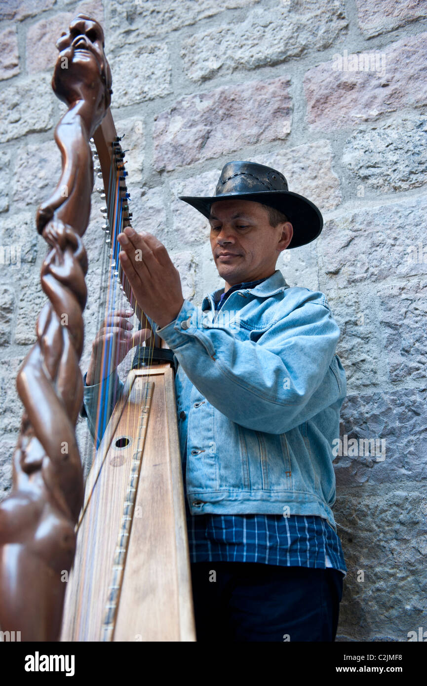 Harp Player performing in the streets of the Gothic area of Barcelona, Spain Stock Photo