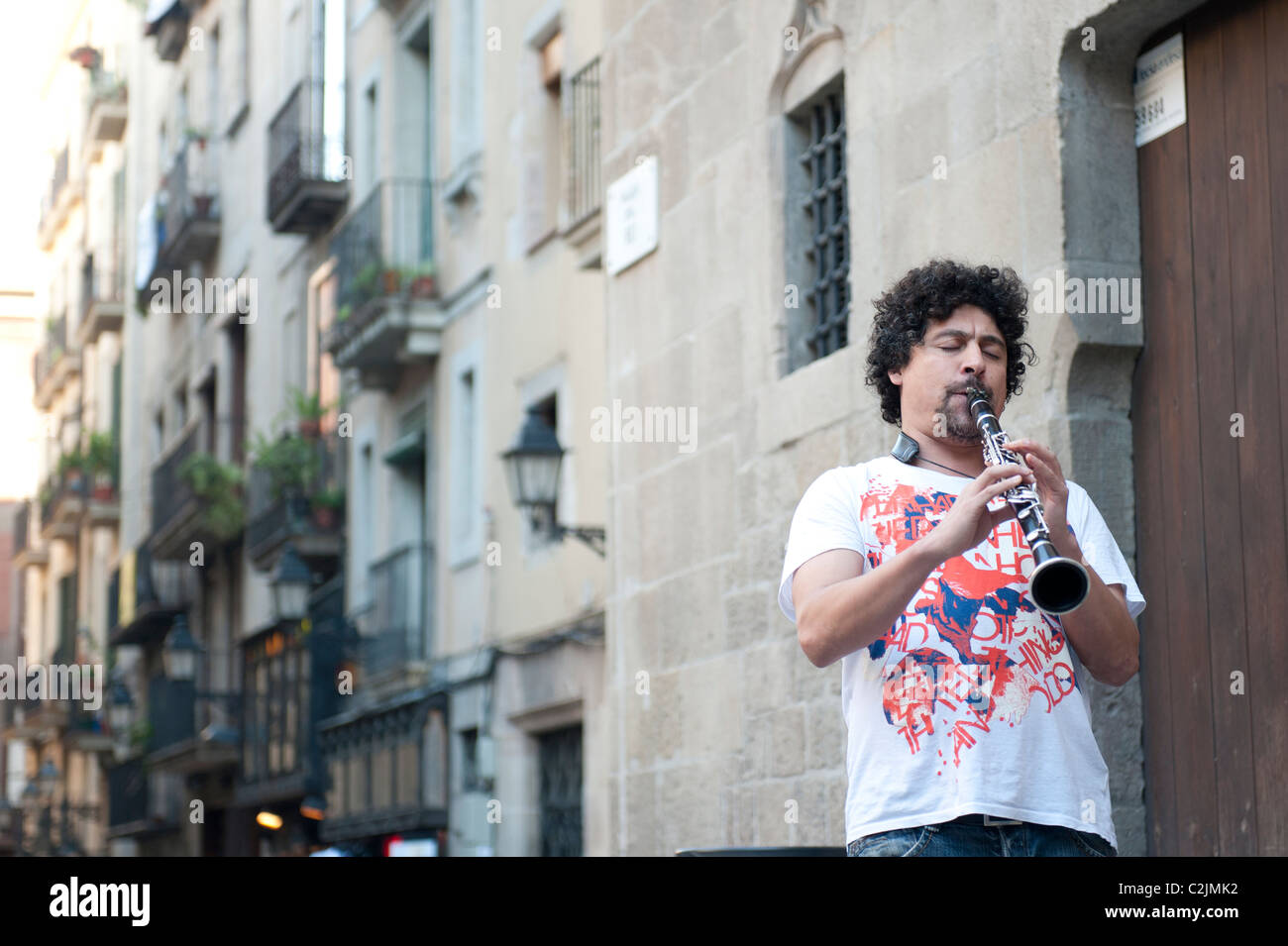 Clarinet player performing in the Gothic part of Barcelona, Spain Stock Photo