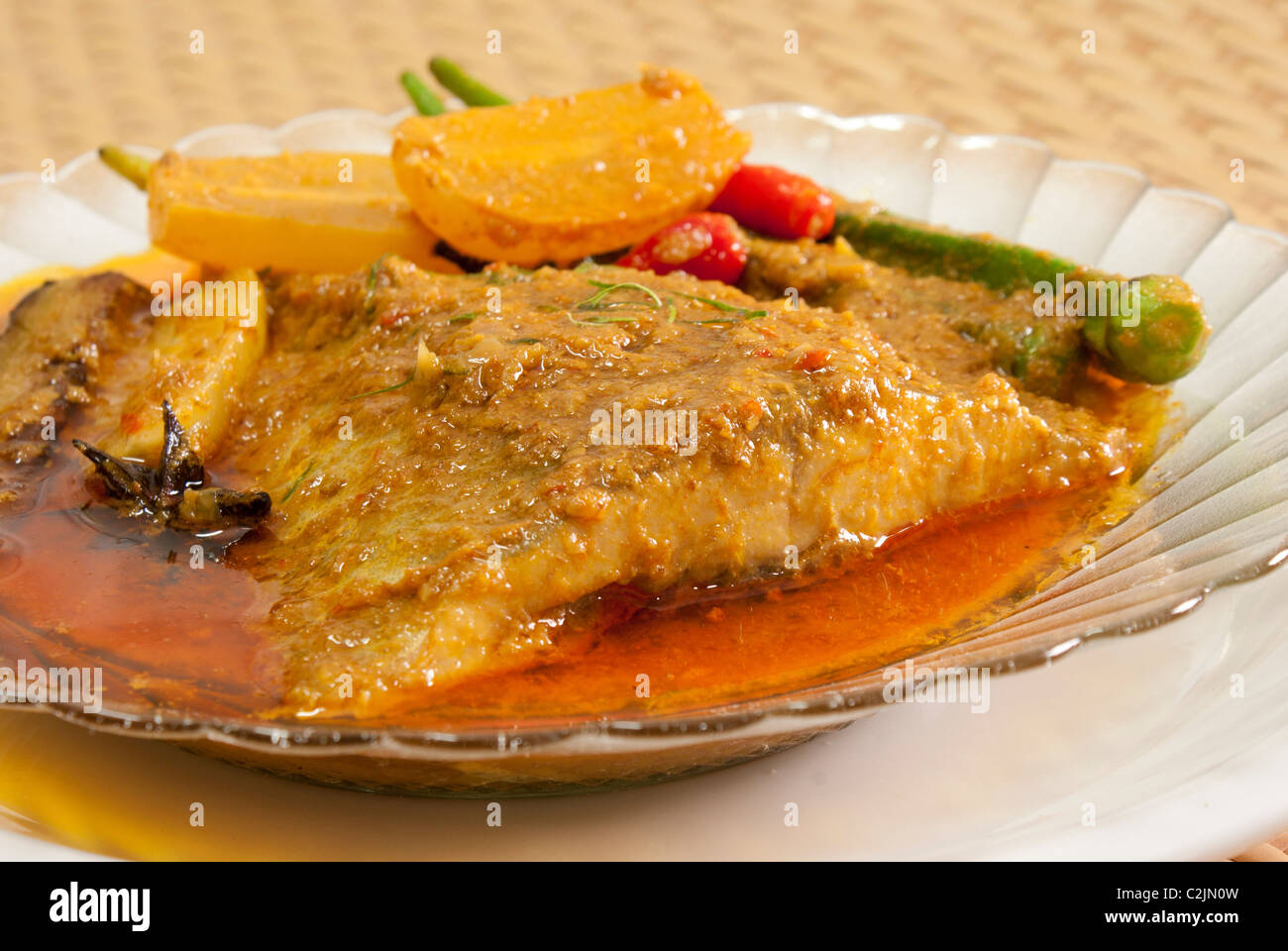 Nonya Asam Fish Tail with Lady's Fingers Stock Photo