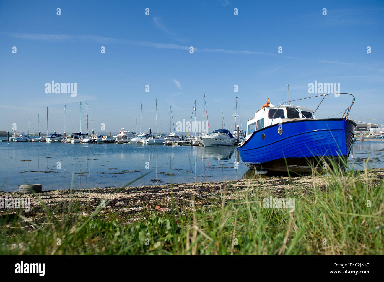 Grounded fishing boat at low tide in Langstone Harbour, Portsmouth