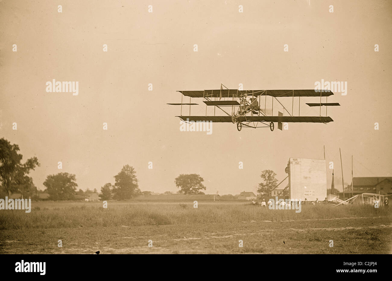 CurtissHerring aeroplane, in fligh over field Stock Photo Alamy