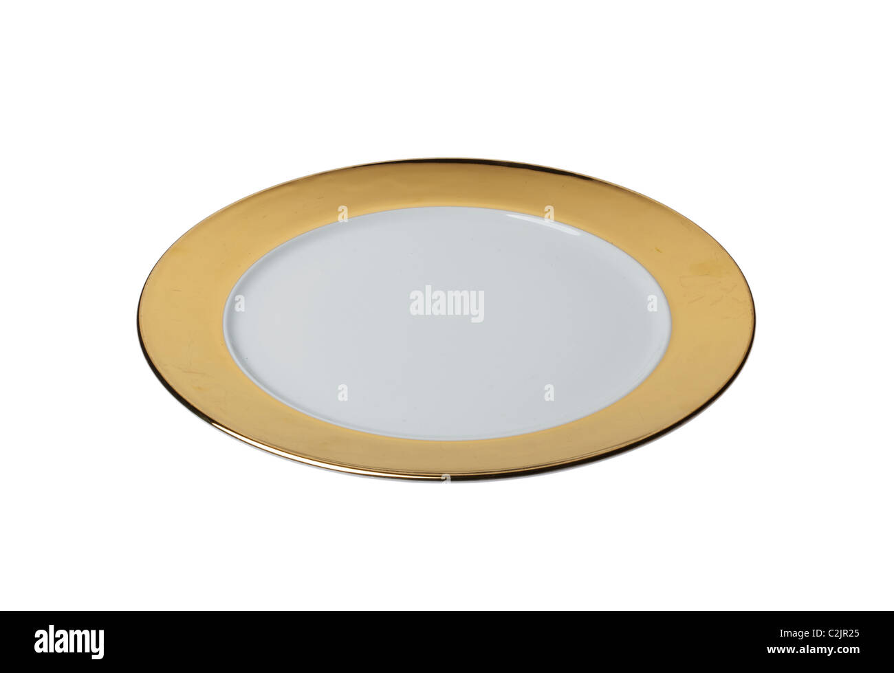 Gold dinner plate cut out against a white background Stock Photo - Alamy