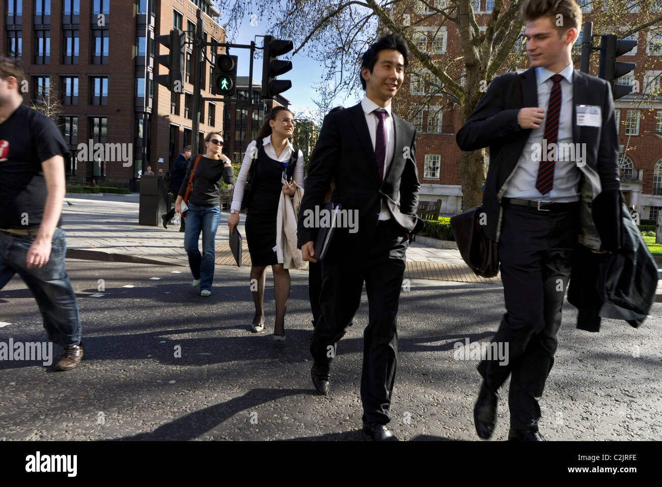 Pedestrians crossing street in London, England, UK Stock Photo