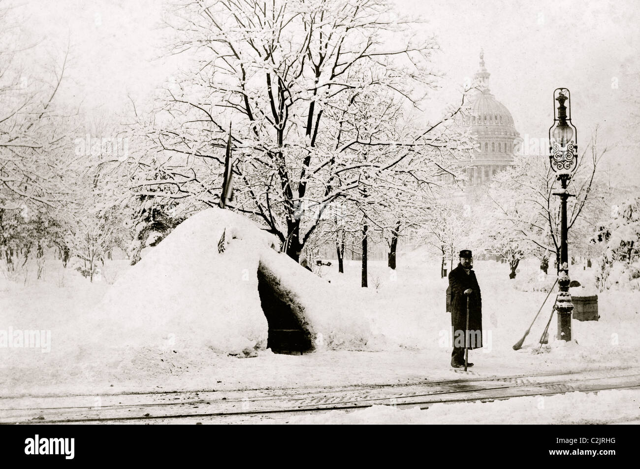 Man standing by snow hut, after blizzard of 1888, with U.S. Capitol in background, Washington, D.C. Stock Photo