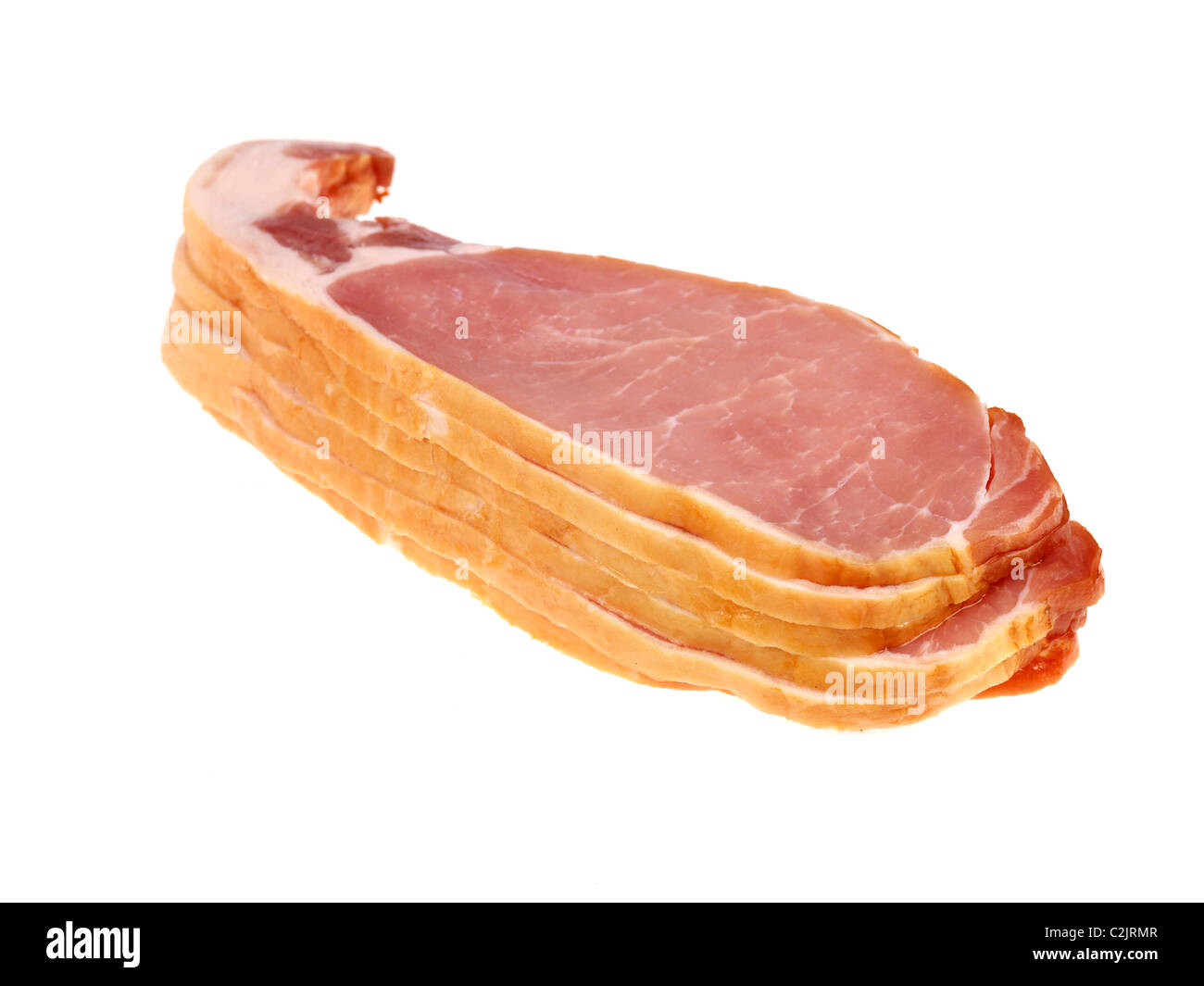 Pile Or Stack Of Uncooked Fresh Raw Smoked Back Bacon Against A White Background With No People And A Clipping Path Ready To Cook Stock Photo