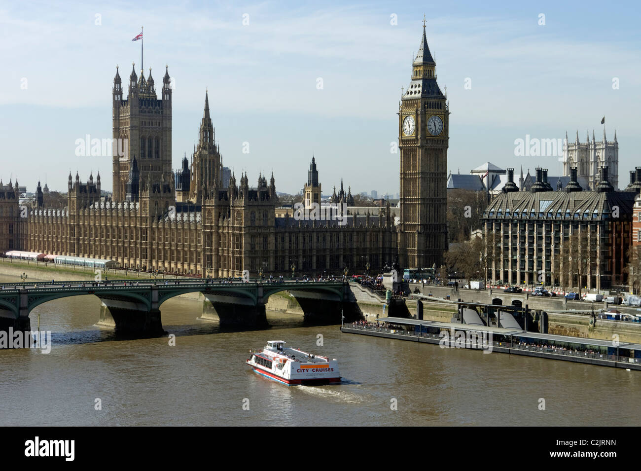City Cruises boat passing by the Houses of Parliament, London, England, UK Stock Photo