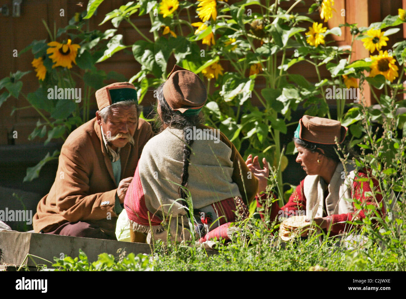 Villagers sitting in the corridor enjoying the early morning sun in ...