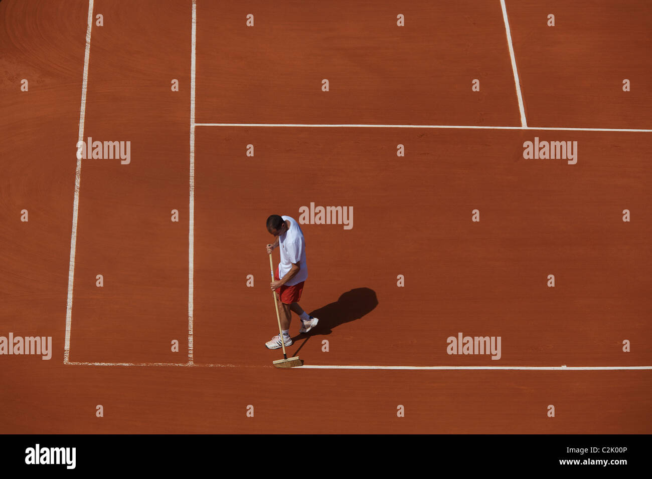 The tennis court lines are cleaned between sets at the French Open