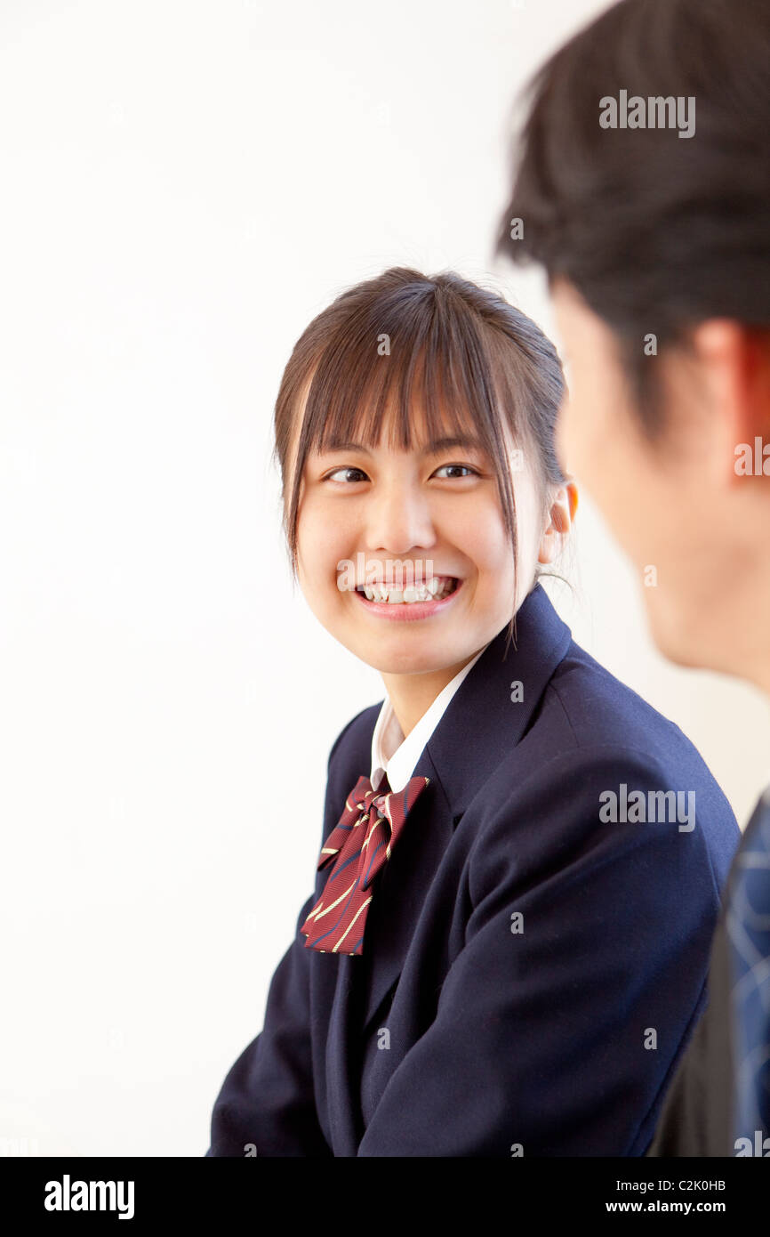 High School Girl Smiling to Teacher Stock Photo