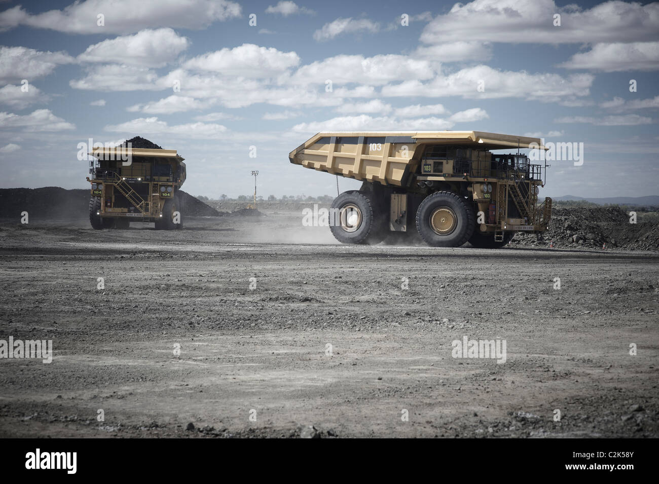 Komatsu 830E Mining dump trucks full of coal Stock Photo
