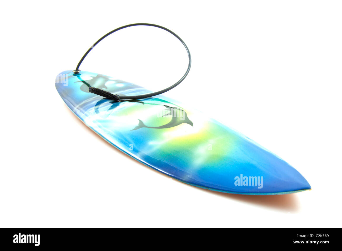 Surf board with dolphin decoration isolated over white Stock Photo