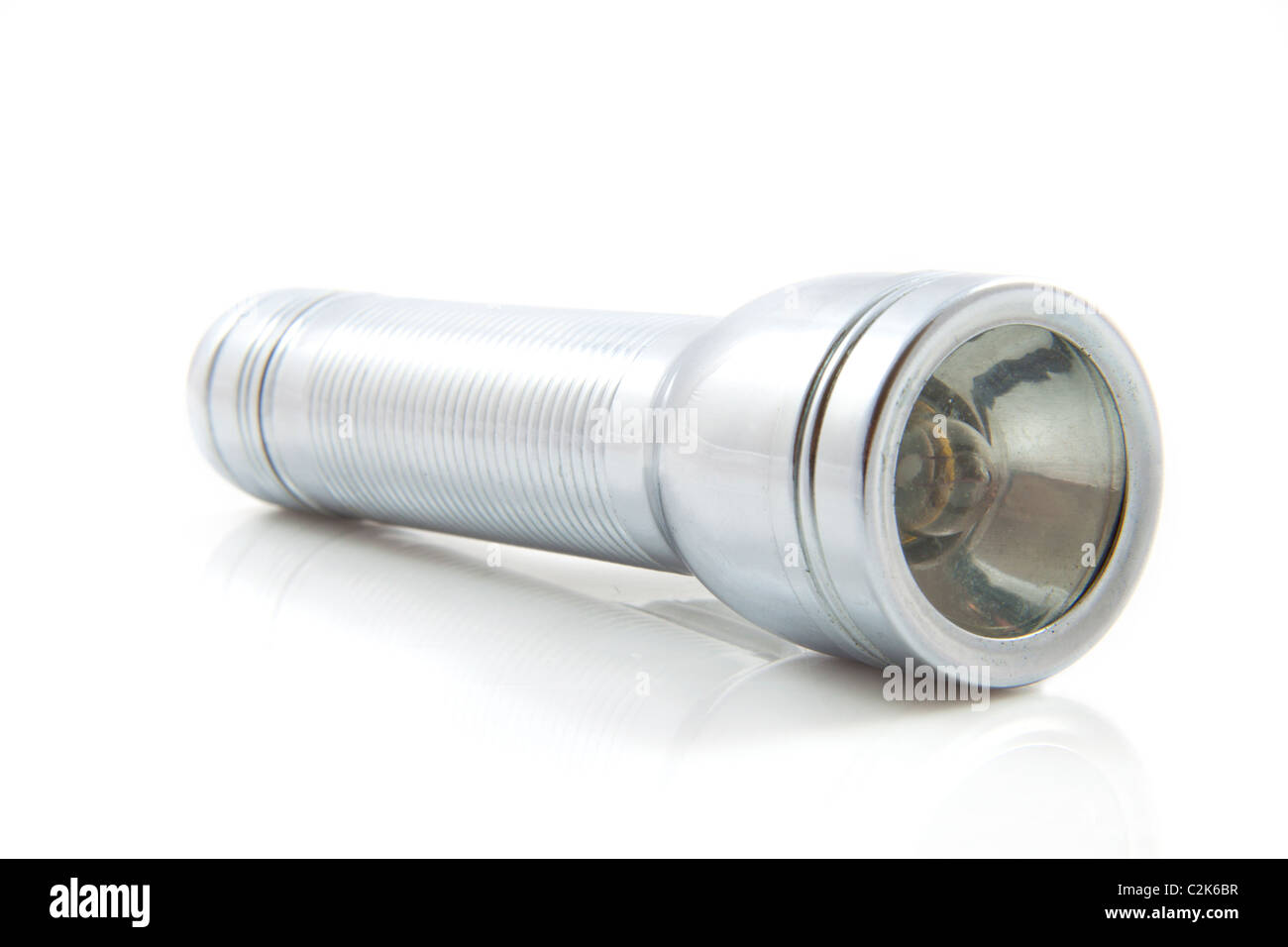 Old flashlight isolated on a white background Stock Photo